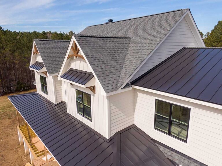 A homeowner examines weathered shingles while checking attic rafters for signs of moisture.